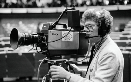 A cameraman films a plenary session